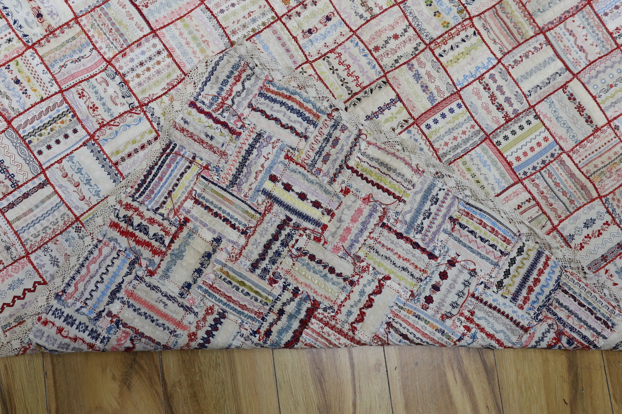 A French early 20th century ribbon patchwork cover with lace trimmimg